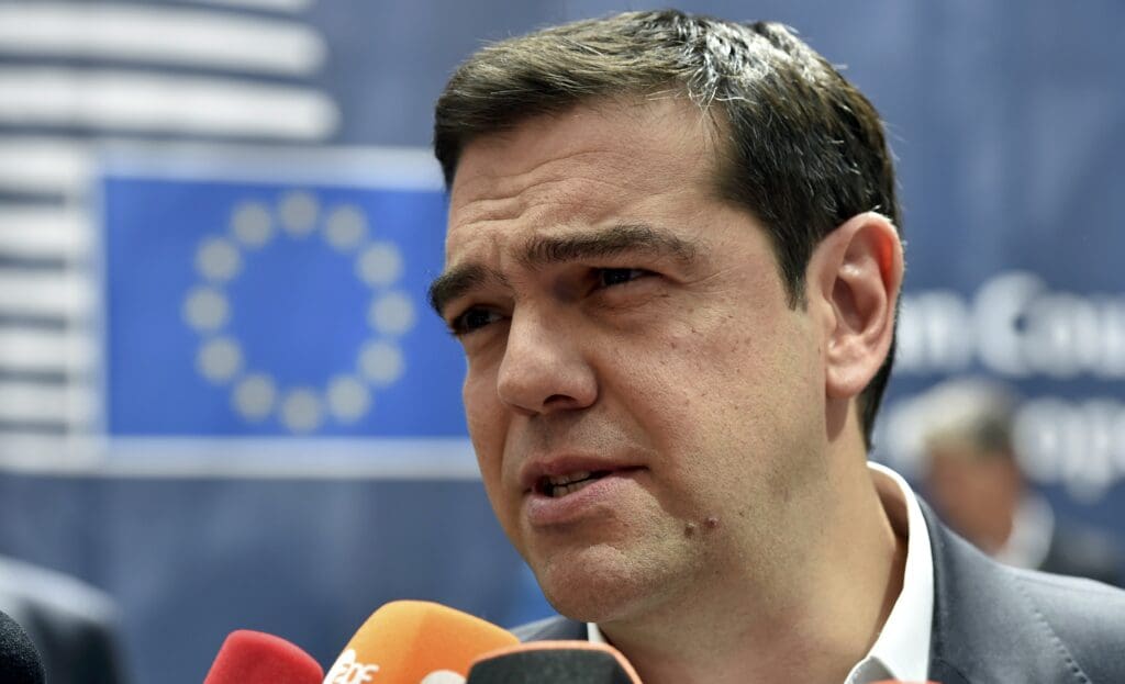 Greece's pm tsipras talks to the media as he arrives at the eu summit in brussels